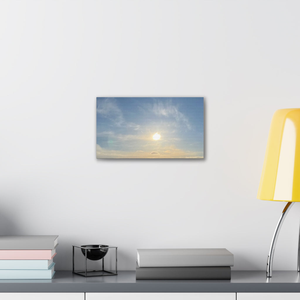 Small rectangular canvas print of sunrise sky with glowing sun and cloud layers