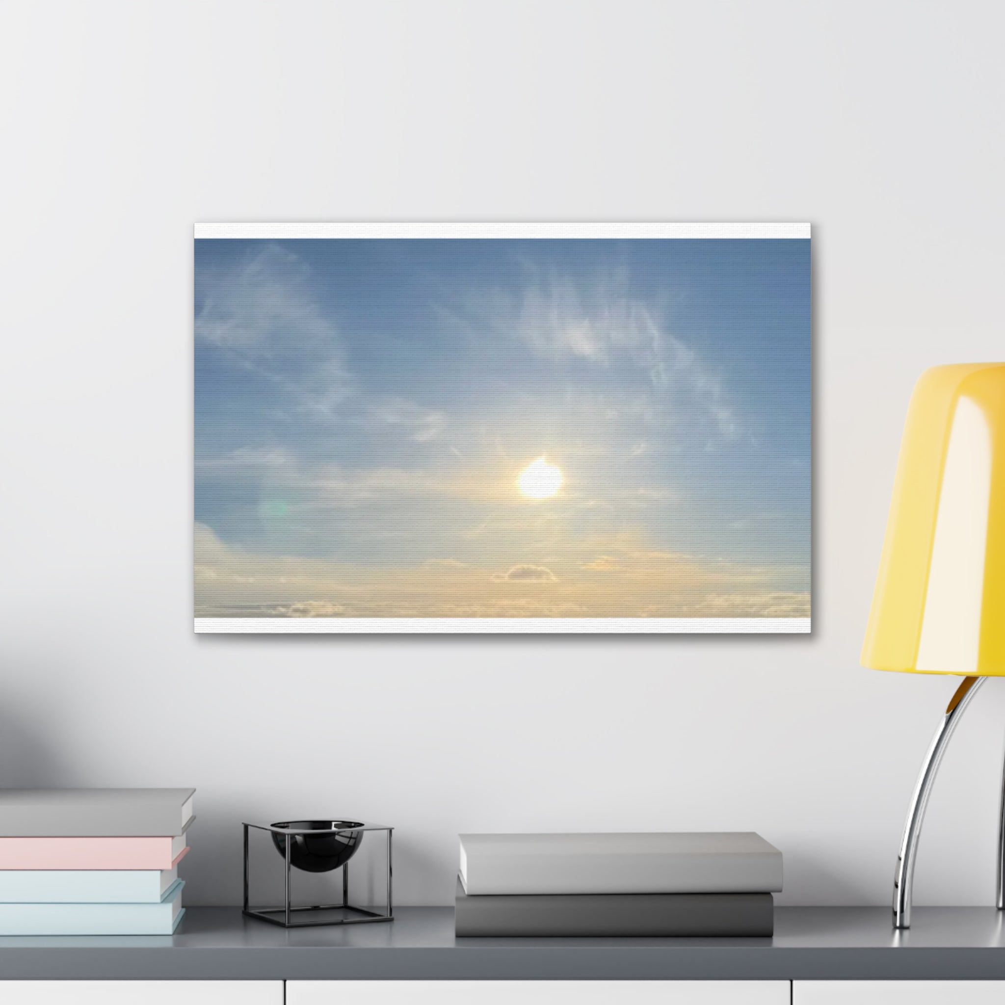 Wall canvas print with sunrise sky, radiant sun through clouds, blue and warm gold tones