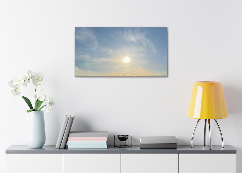 Wall-mounted canvas print featuring sunrise sky with glowing sun and soft cloud layers