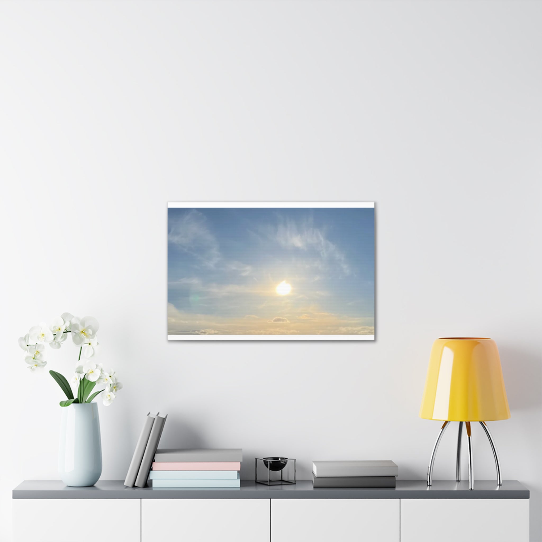 Wall canvas print of sunrise sky with bright sun, soft clouds, and blue-gold color blend