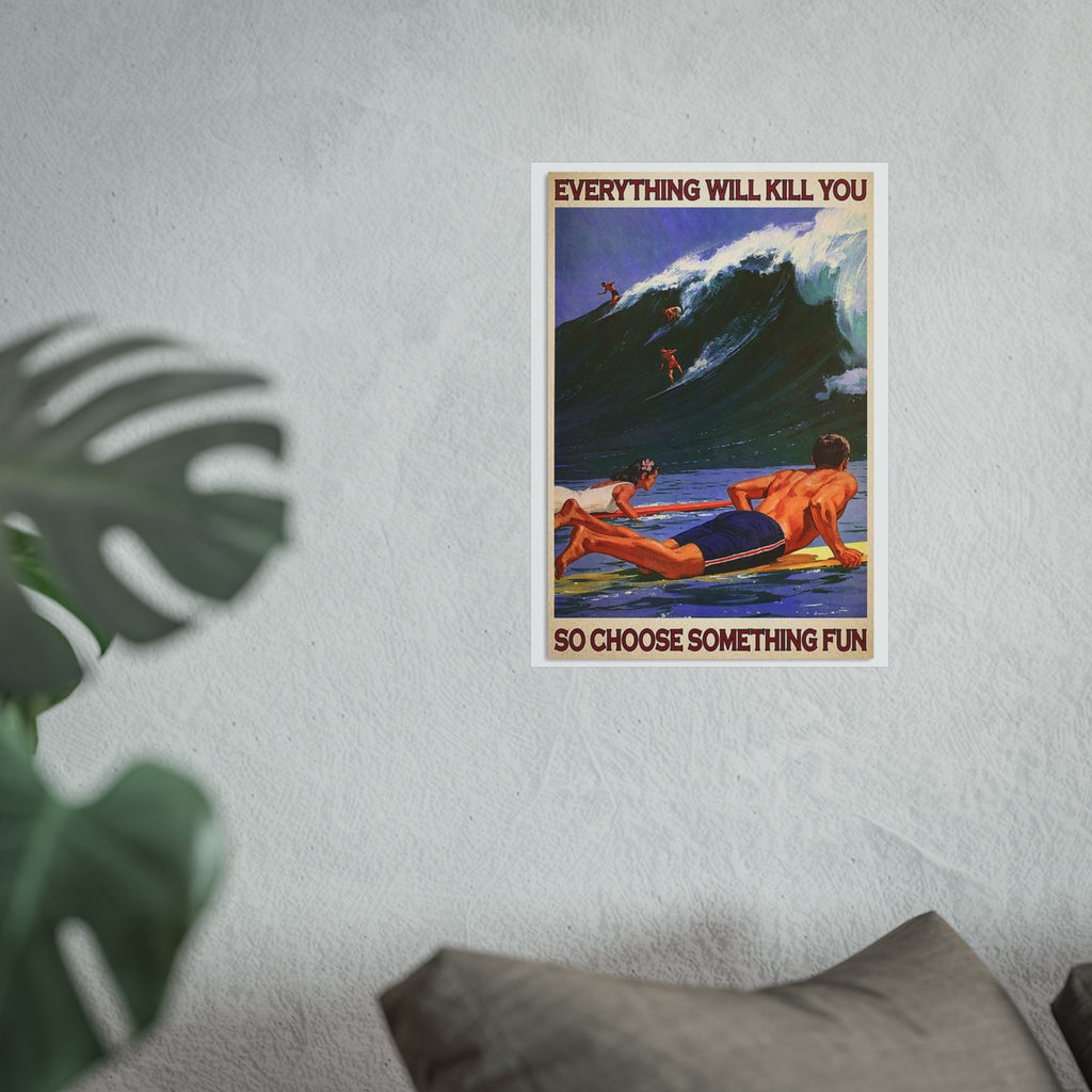 Small framed surf poster on a light wall, with surfers on waves and red quote text.