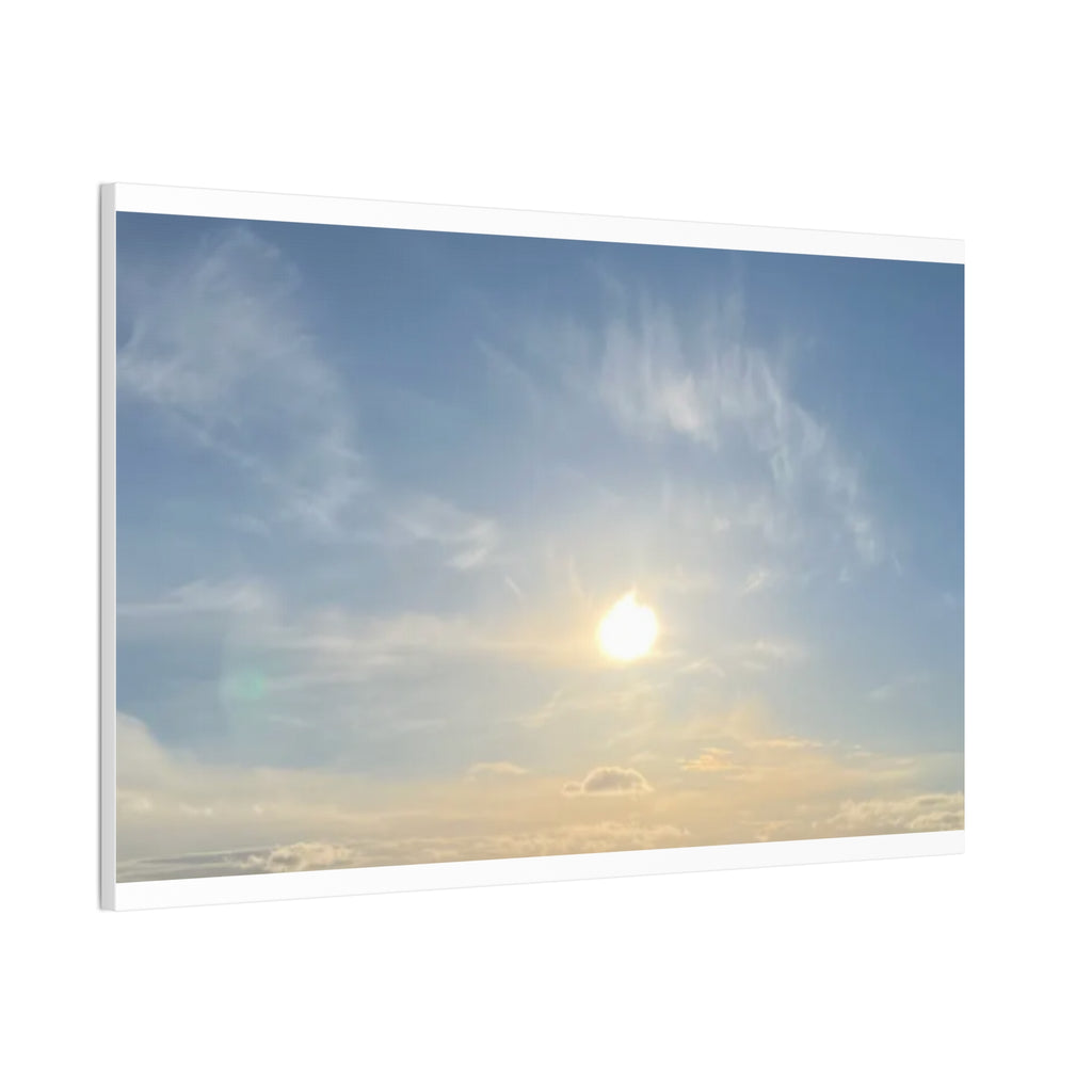 Framed landscape canvas print with sunrise sky, bright sun, and cloud streaks in blue-gray