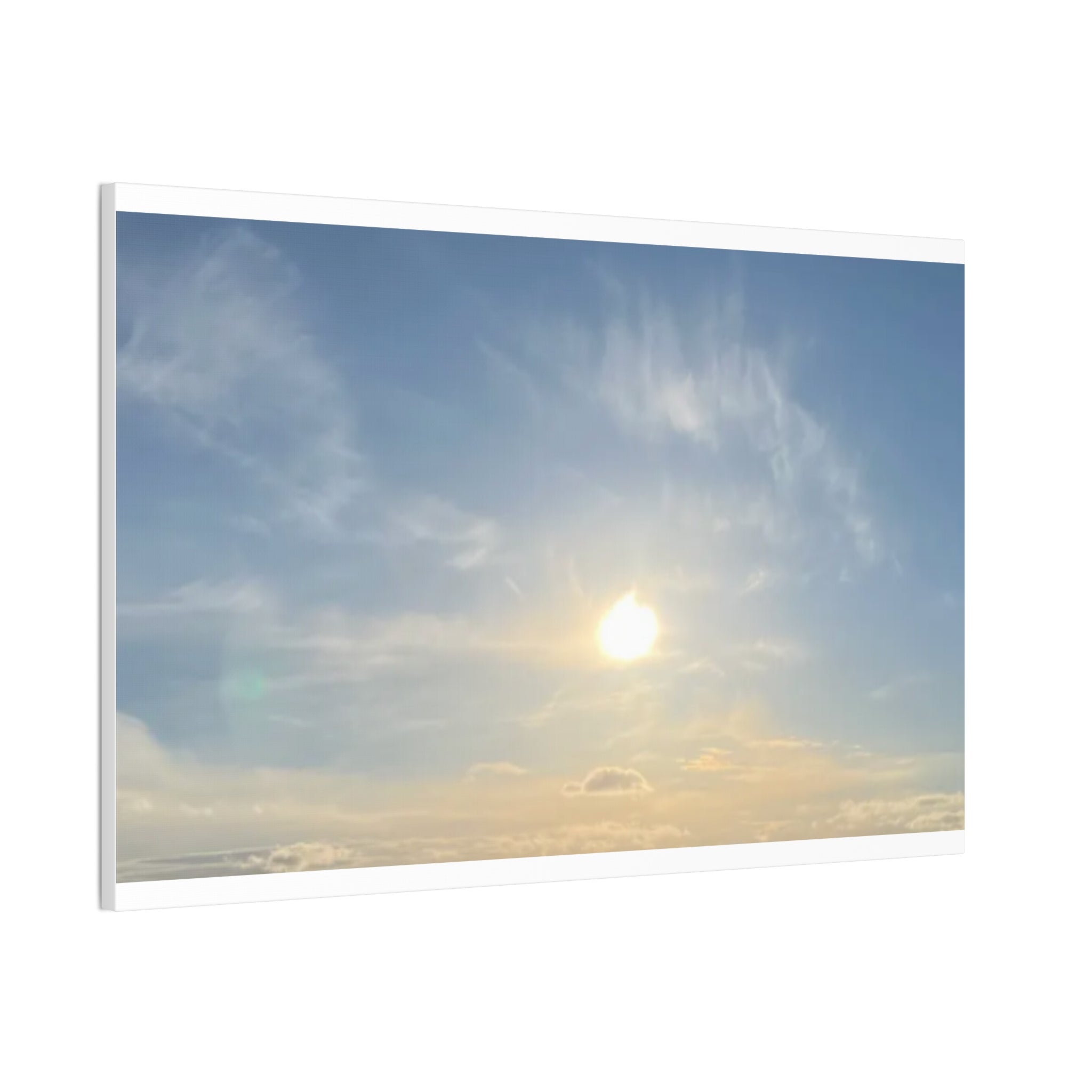 Framed landscape canvas print with sunrise sky, bright sun, and cloud streaks in blue-gray