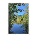 Landscape canvas print with calm lake and surrounding green trees