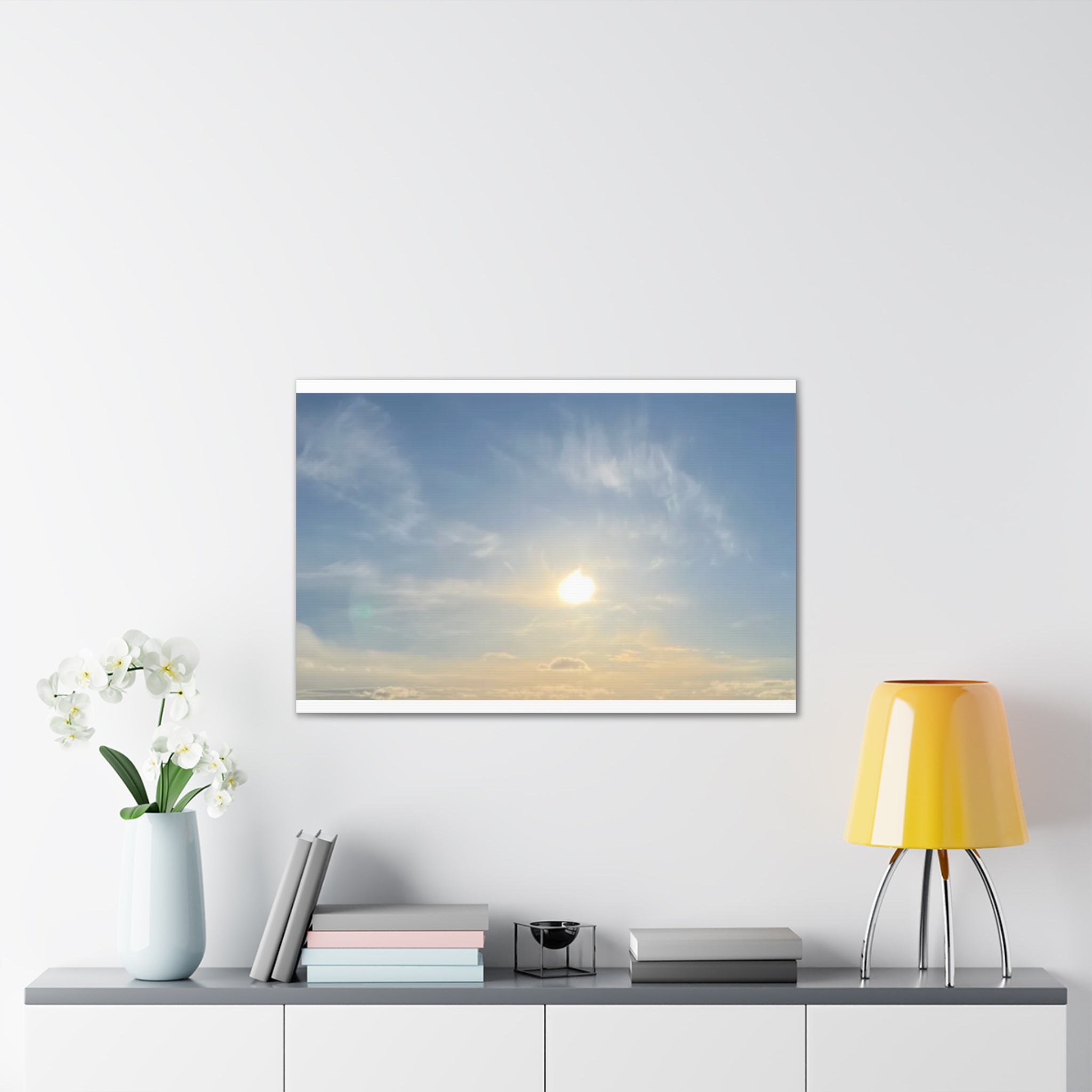 Sunrise sky canvas print showing bright sun, blue-gray clouds, rectangular canvas