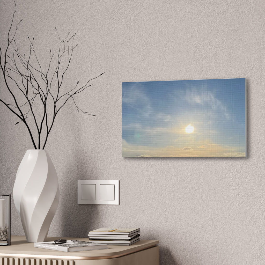 Wall canvas print showing sunrise sky with bright sun, wispy clouds, and blue-gold gradient